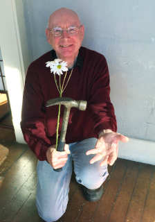 Phil with flower and hammer