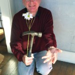 Man with flower and hammer