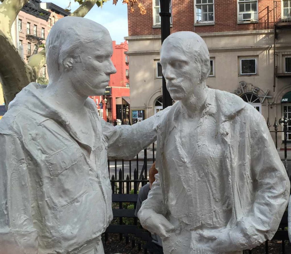 Statue of two men listening