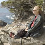 Woman alone looking at ocean