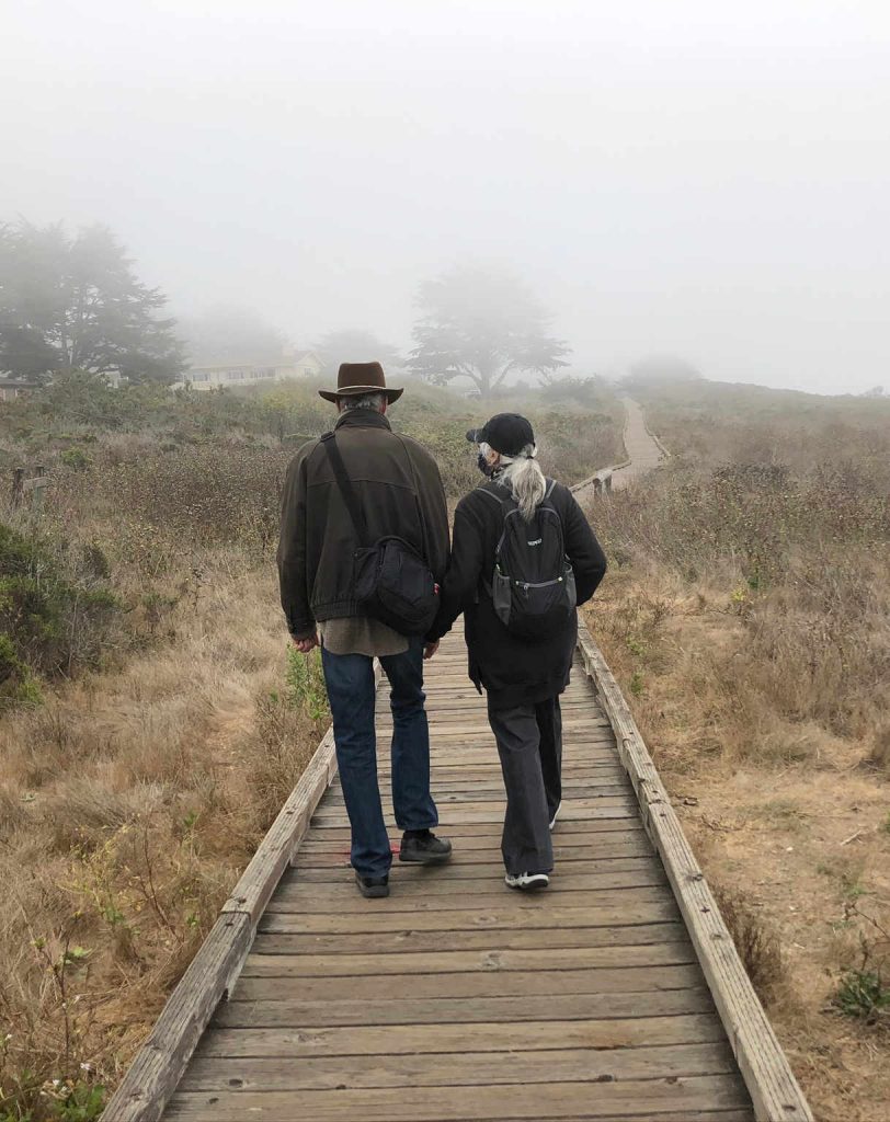 Couple walking in fog