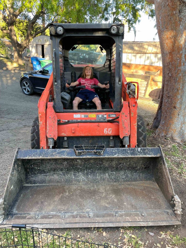 Child driving backhoe