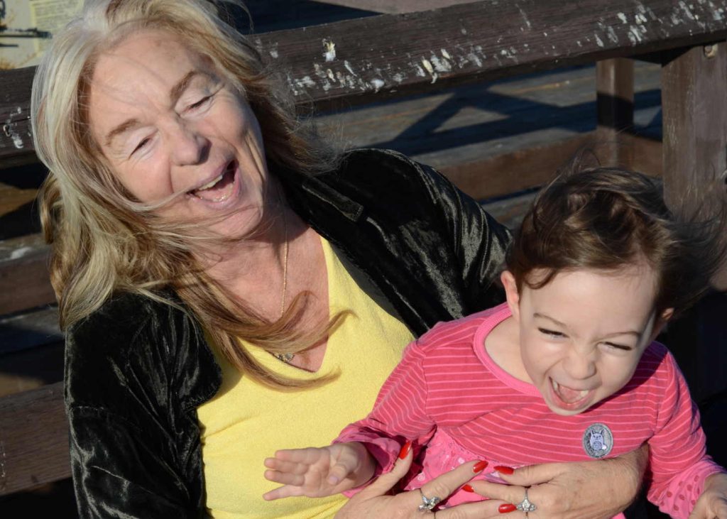 Grandmother and granddaughter laughing