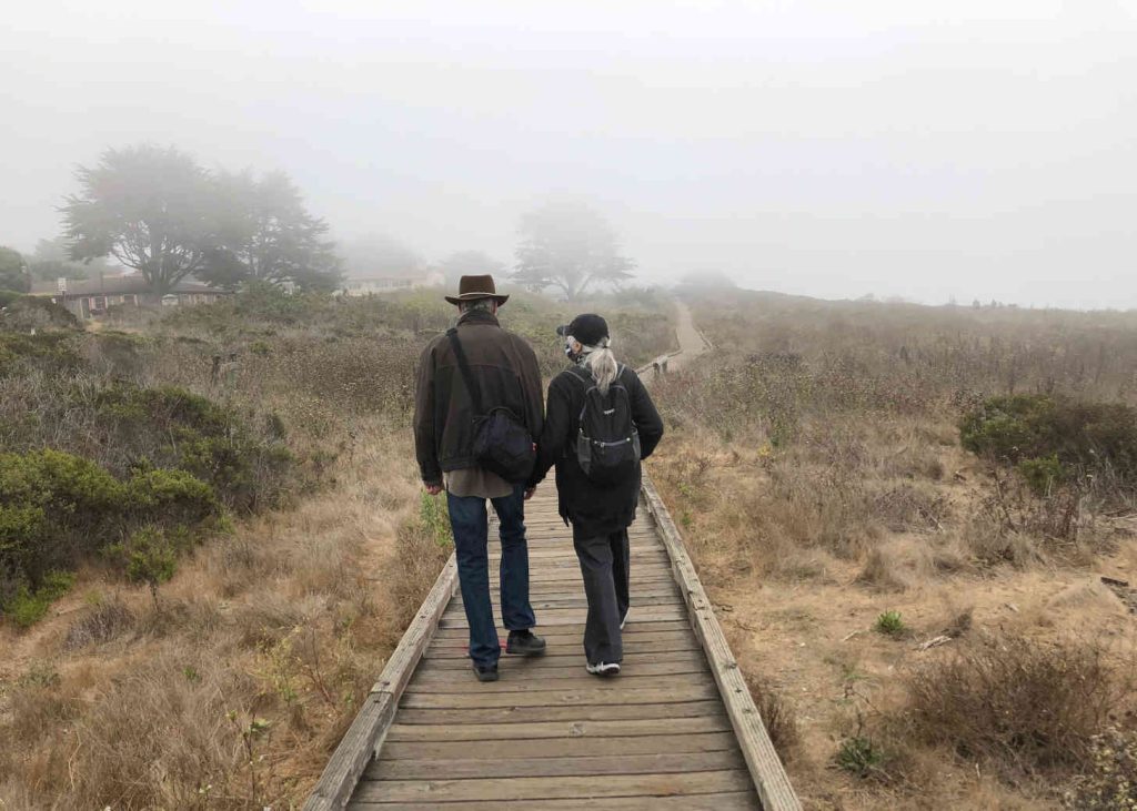 Couple walking in fog