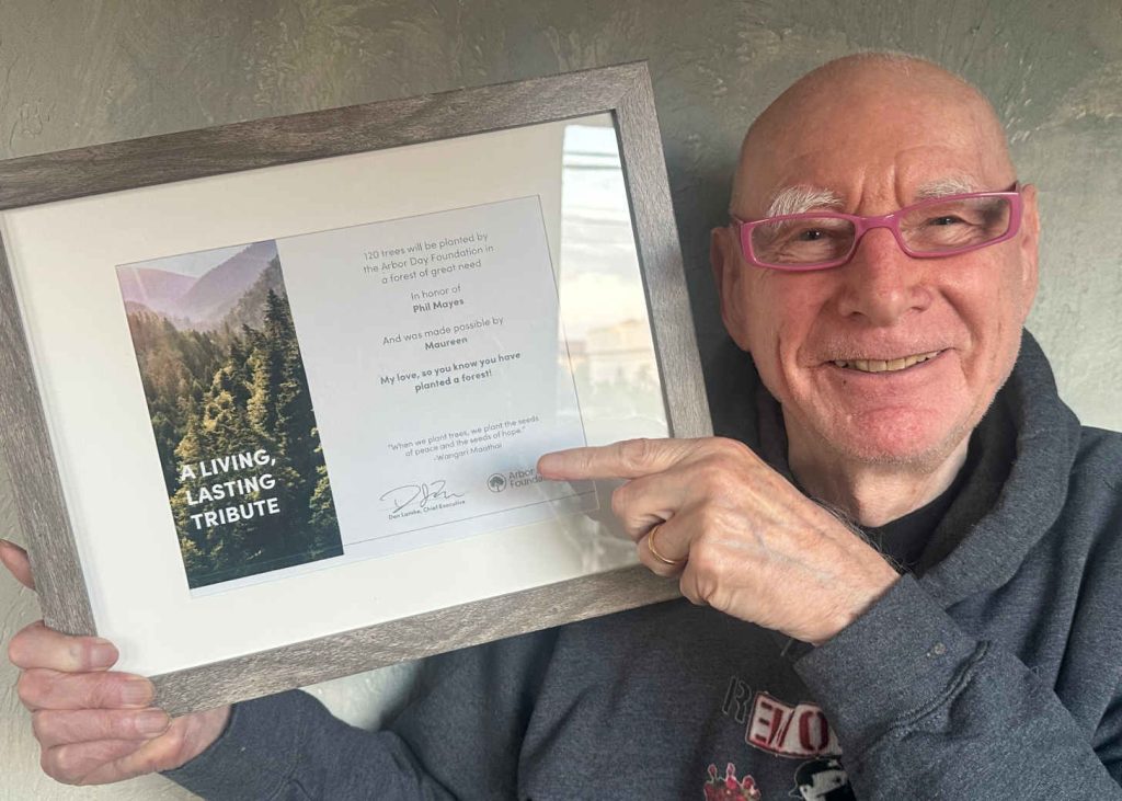 Phil with a thank you certificate