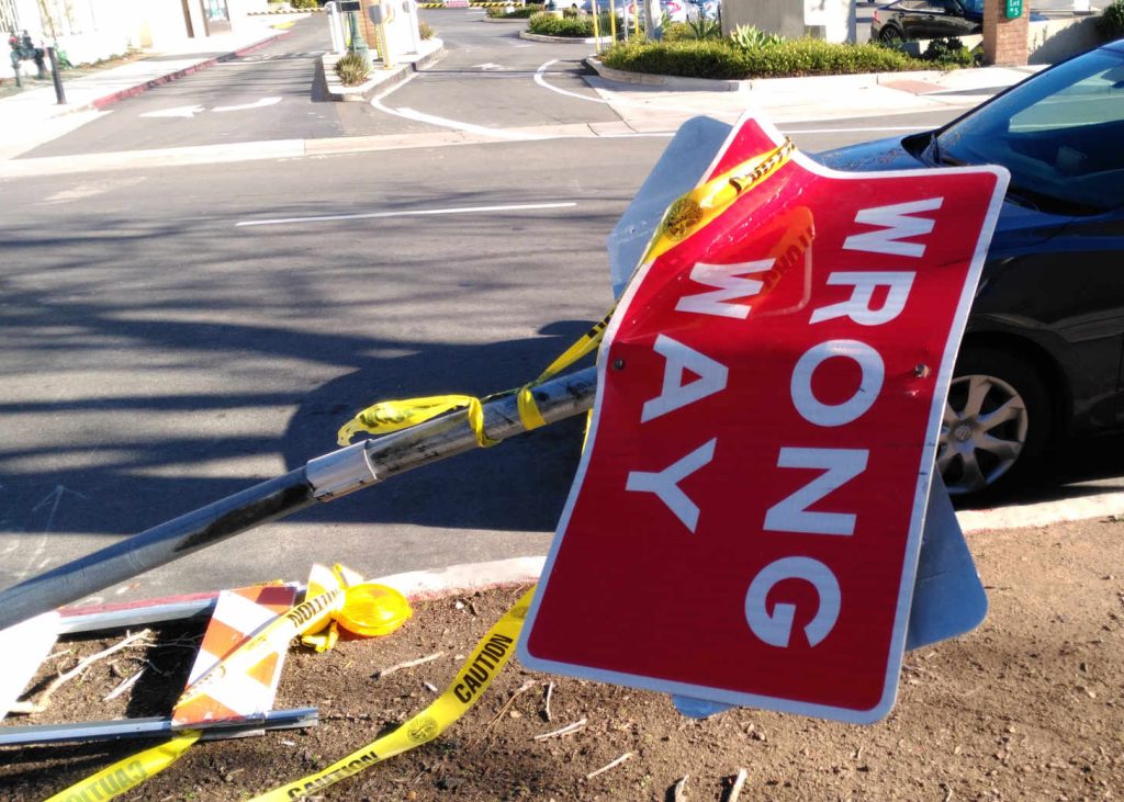 Wrong Way road sign knocked over