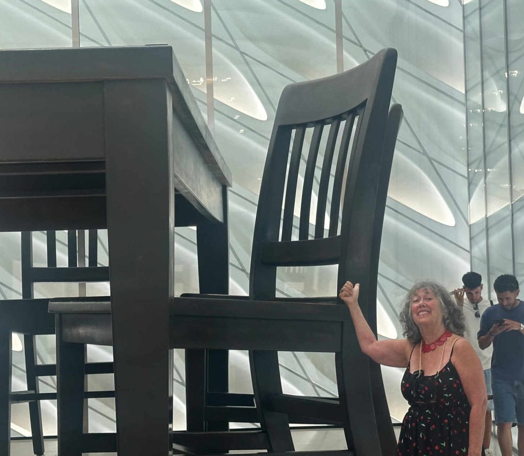Woman next to giant table